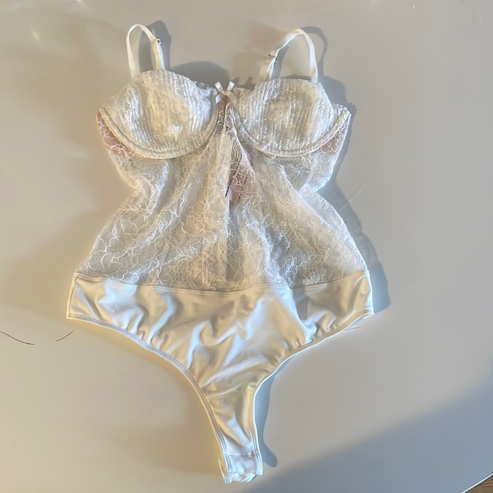 Ivory lace bodysuit.